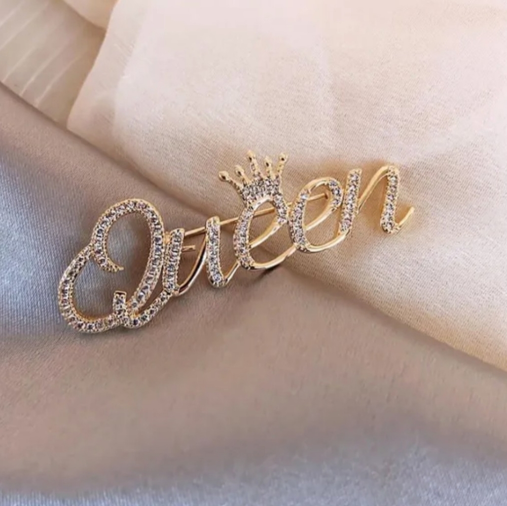 Queen brooch